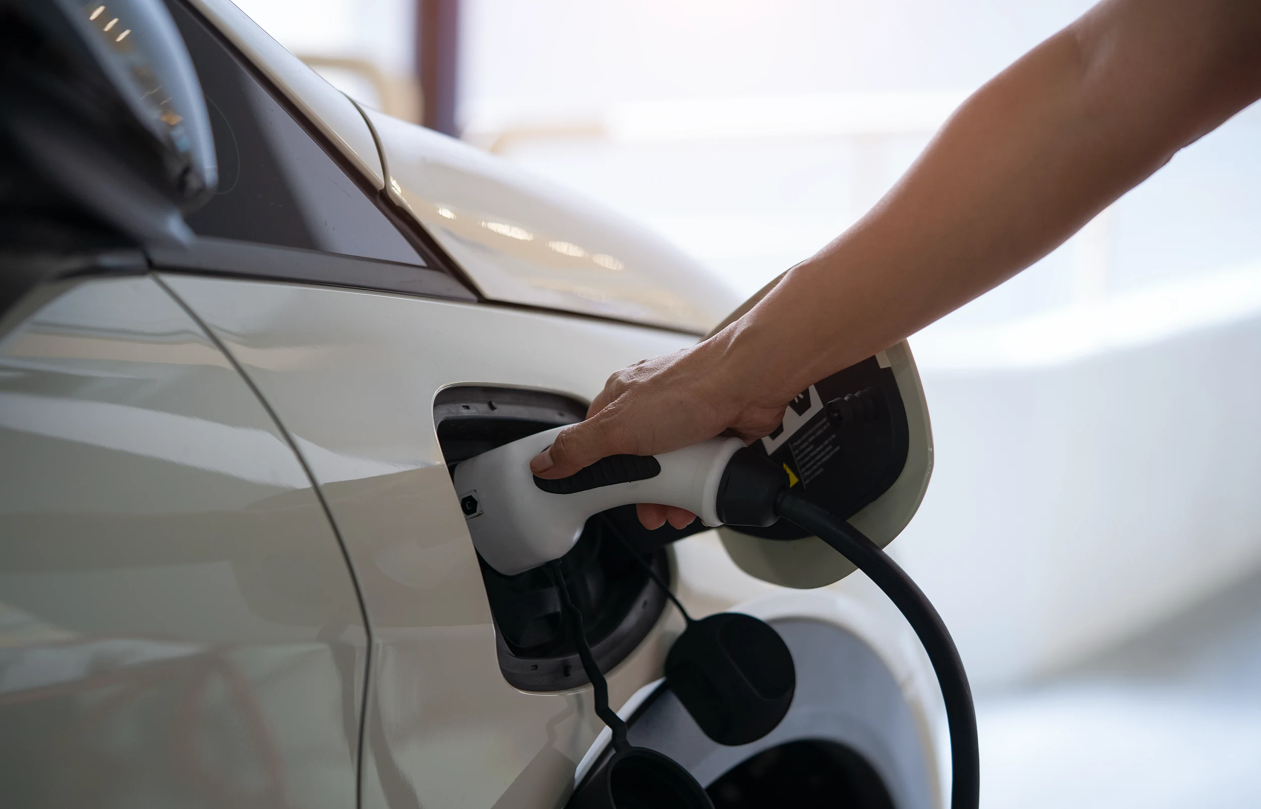 EV charging cable connected to an electric vehicle