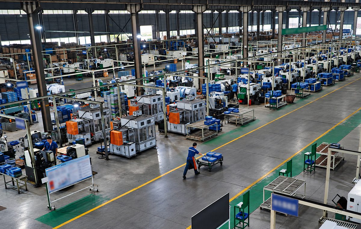 Automotive component factory with production equipment and organized workstations