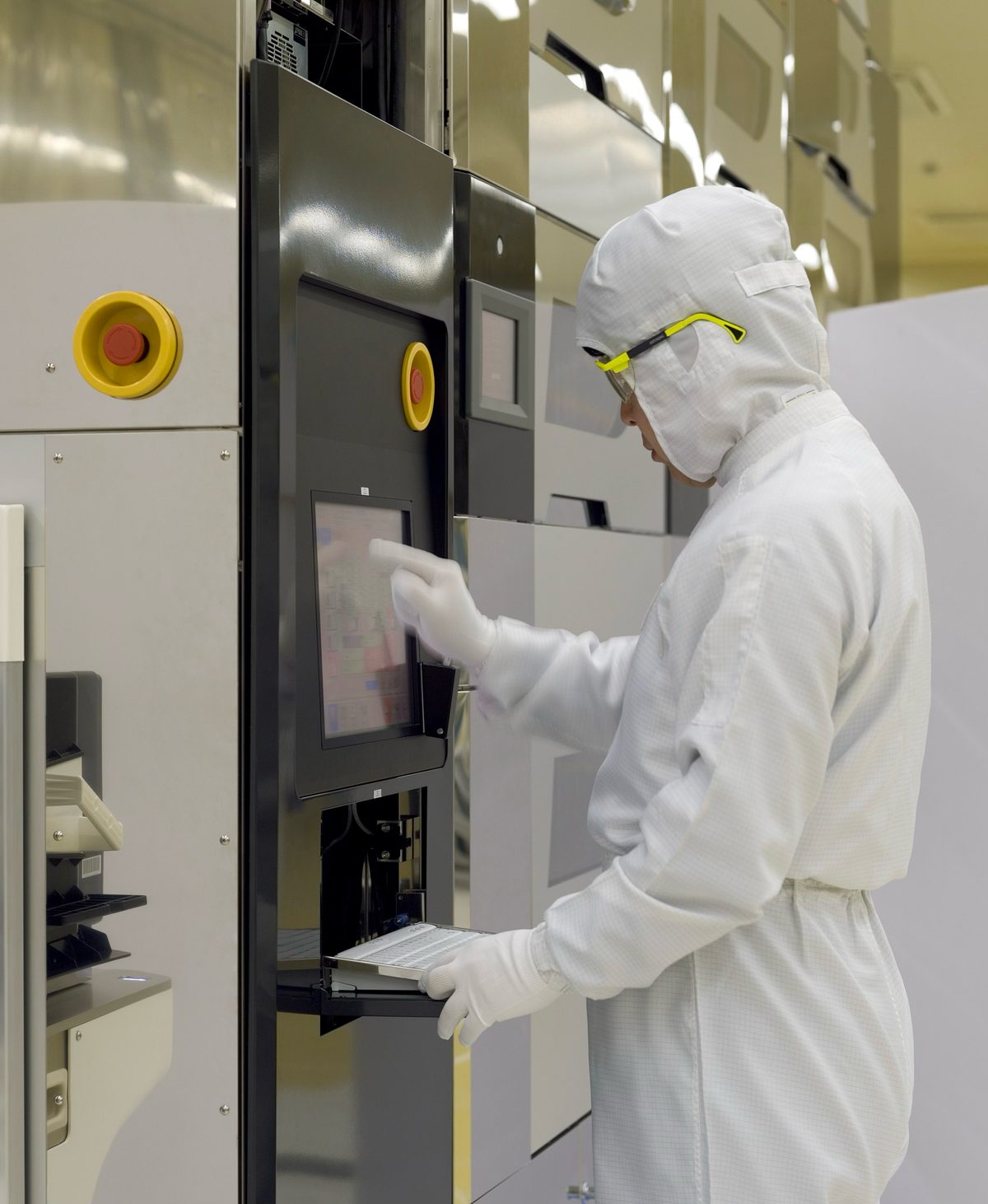 Quality control specialist operating laboratory inspection equipment